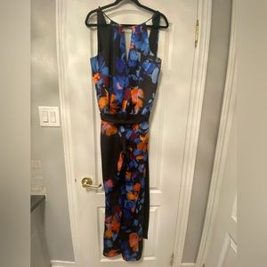 One colourful jumpsuit black orange and blue.